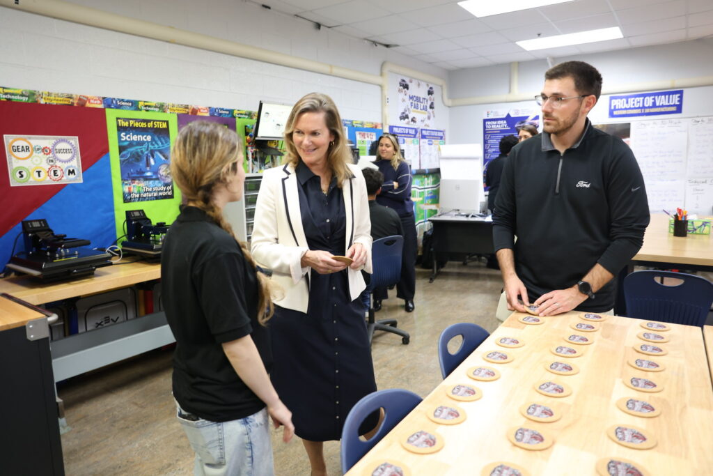 Students and guests in the Ford Future Builders Lab at Western International High School